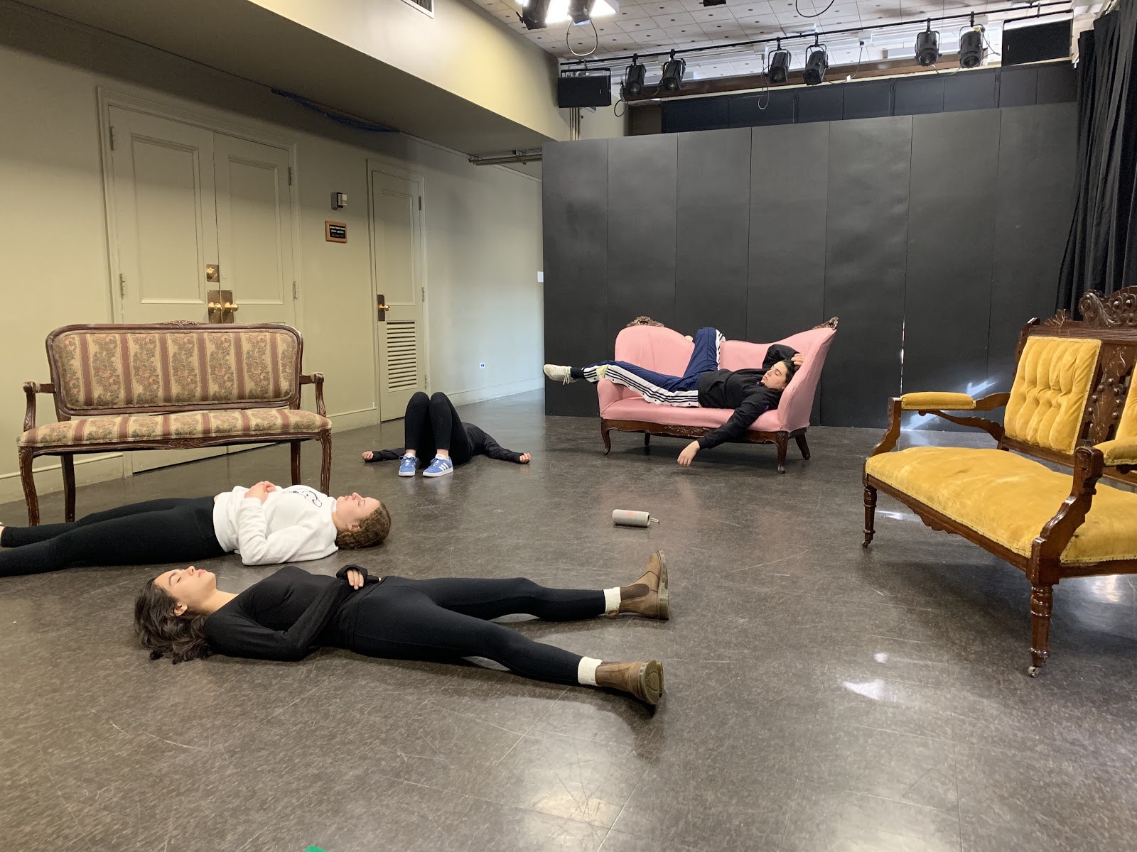 Students sleeping/lounging on sofas or the floor