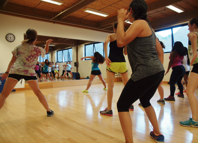 Working out at dance fitness class 