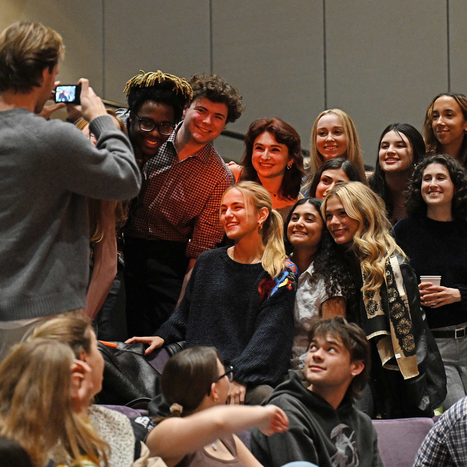 Students pose for a photo before the start of the student film festival..