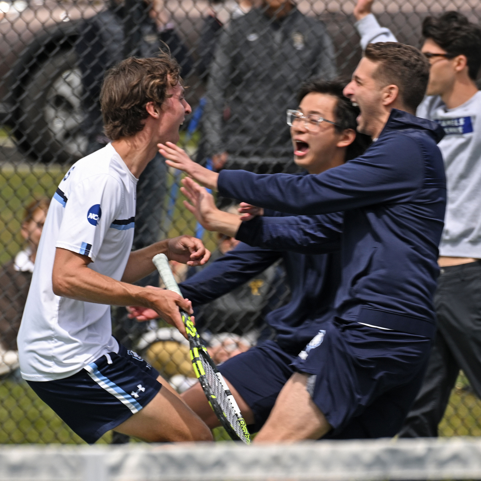 tennis players celebrate a big win