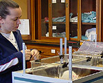 Andrea Rodrigues '06 prepares to inject rats with cocaine, which will increase their movement in the observation chamber.